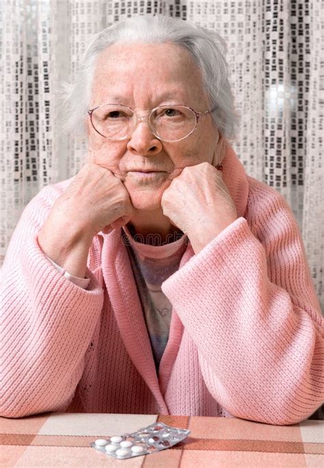 Old Sad Woman With Pills At Home Stock Photo Image Of Aged Sickness