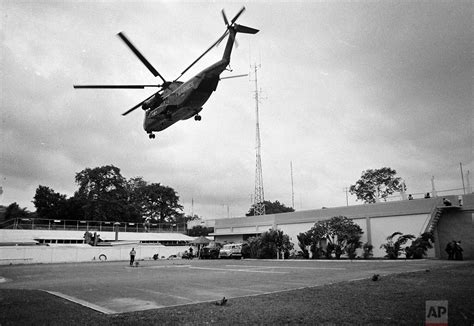 An air america helicopter crew member helps evacuees up a ladder on the roof of 18 gia long street on april 29, 1975, shortly before the city fell to. The Fall of Saigon, April 30, 1975: The end of the Vietnam ...