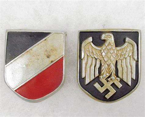 Here are some examples from the centra. SET OF 2 GERMAN NAZI HELMET BADGES