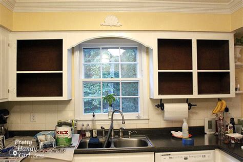 See the before and after by clicking here. Fabric Backed Open Kitchen Cabinets - DIY on a Dime the Tutorial - Pretty Handy Girl