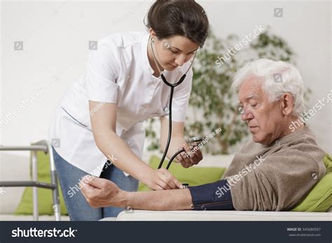 Young Nurse Taking Old Mans Blood Stock Photo 345680597 Shutterstock