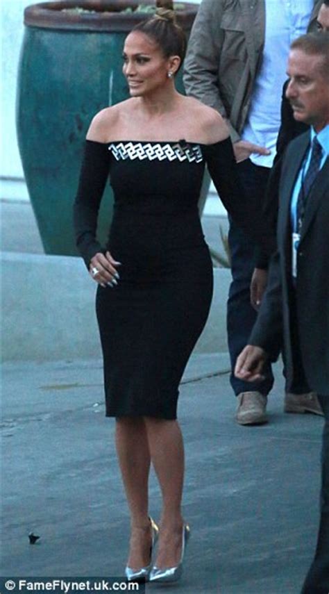 jennifer lopez struggles to walk in her too tight dress daily mail online