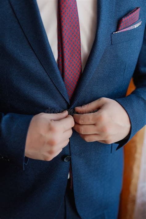 A Man And A Successful Businessman Straightens His Jacket Stock Image