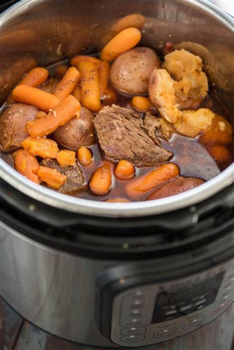 pressure cooker pot roast cooked in an instant pot with potatoes carrots and juices pressure
