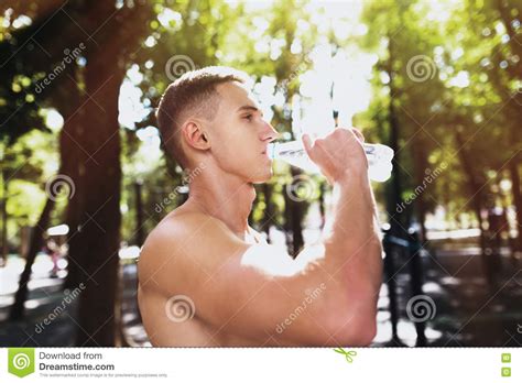 Athletic Sport Man Drinking Water From A Bottle Outdoor Fitness Stock