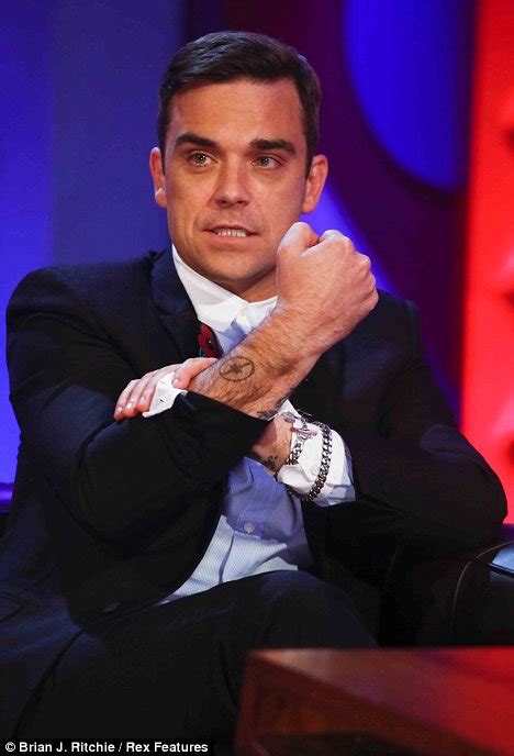 So close, that they decided to give each other matching 'x' tattoos, backstage at the x. Robbie Williams shows off his Take That 'tribute' tattoo ...