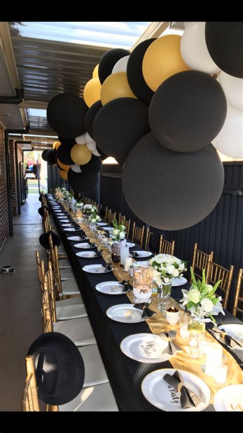 Also get advice on what wines to pour, classic cocktail recipes to serve, and how to create a. 50th long table setting! Black, gold and white. | Birthday ...