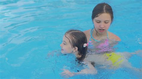 Girl Teaches Younger Sister To Swim Stock Footage Sbv 320193291