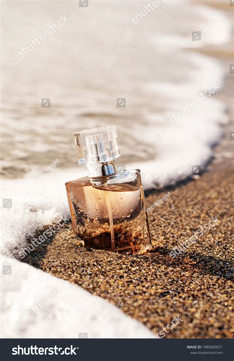 Bottle Perfume On Seashore Enveloped Wave Stock Photo 1980069071