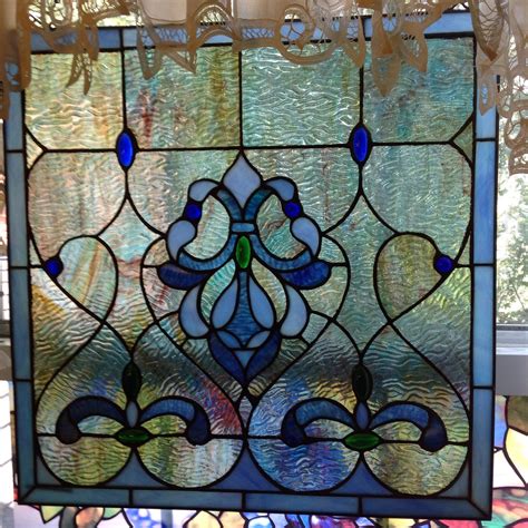 We believe in helping you find the product that is right for you. Blue stained glass and water glass hangs in bathroom ...