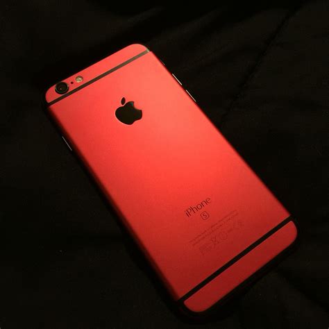 An Apple Iphone Is Shown In The Dark