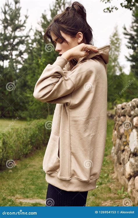 Gorgeous Brunette Woman In Fashion Hoodie In The Garden Alley Stock Image Image Of Dress