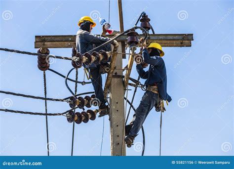 Electricians Resting While Working On Electricity Pole Editorial Photo