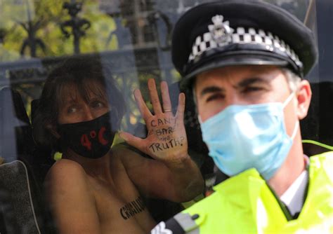 Topless Women Lock Themselves To U K Parliament In Extinction