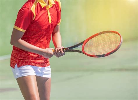 Female Tennis Player With Racket Preparing To Play Tennis During