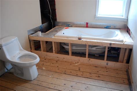 Build A Frame Around A Bathtub And Install Tiling For A Built In