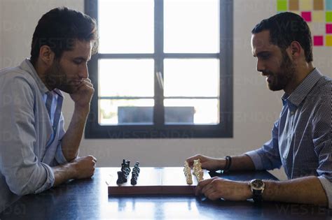 Two Men Playing Chess Stock Photo