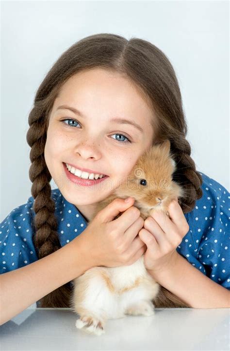 Happy Little Child Girl With Cute Rabbit Portrait Of Kid With Pet