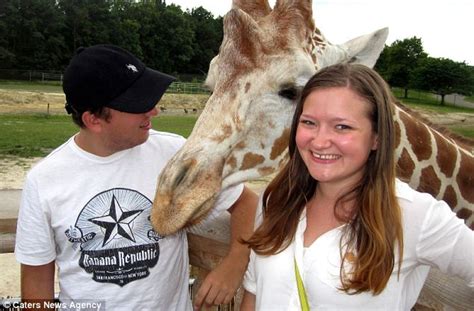 Giraffe Photobombs Couple At Safari Park While Blowing A Raspberry At