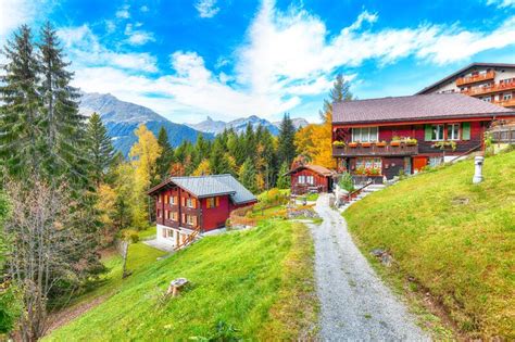 Fantastic Autumn View Of Traditional Swiss Chalets In Wengen Village