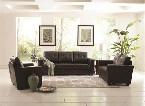 Purchase red and brown toned flooring to add warmth and coziness. Black Leather Sofa on white tile floor connected by ...