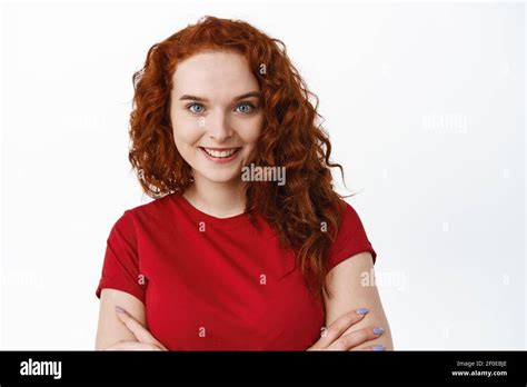 Close Up Portrait Of Confident Woman With Ginger Curly Hair Cross Arms