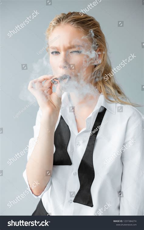 Elegant Stylish Blonde Girl Smoking Cigar Stock Photo 1231584274