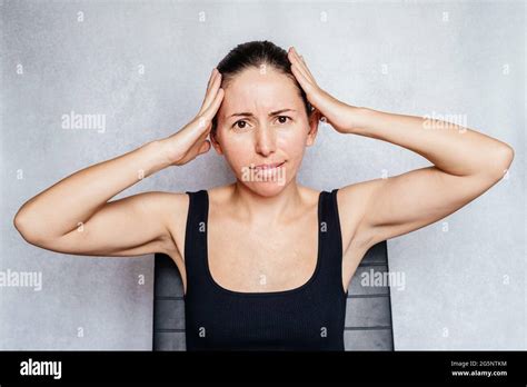 A woman having headache, exercises to beat headache Stock Photo - Alamy