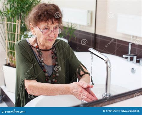 Elderly Old Woman Washes Her Hands Stock Photo Image Of Females
