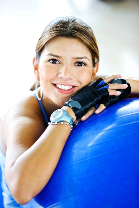 Gym Woman Doing Pilates Exercises On A Blue Ball Freestock Photos