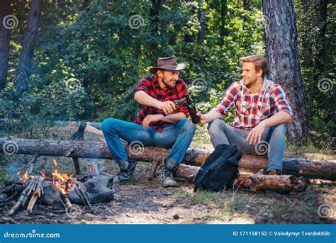 Two Handsome Men Friends On Camping Near Campfire Tourists Relaxing