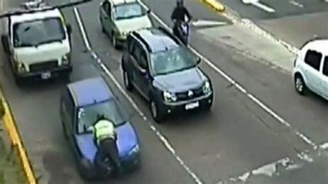 Inspectors Ride On Bonnet Of Moving Car In Buenos Aires Bbc News