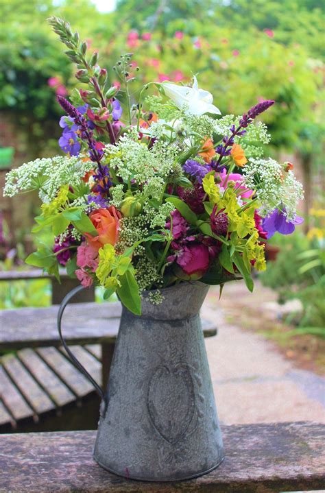 Early Summer Mixed Bouquet In Metal Jug Flower Arrangements Flowers