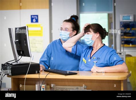 Nurses Working At The Nurses Station In The Acute Receiving Ward At The