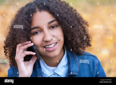 Outdoor Portrait Of Beautiful Happy Mixed Race African American Girl