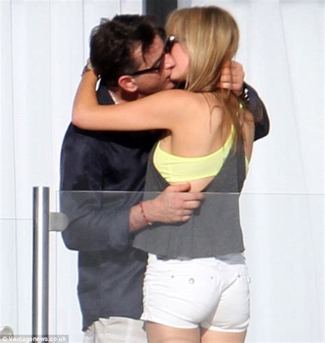 Charlie Sheen Enjoys A Passionate Kiss With Adult Film Star Brett Rossi