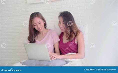Young Asian Women Lesbian Happy Couple Using Computer Laptop Checking
