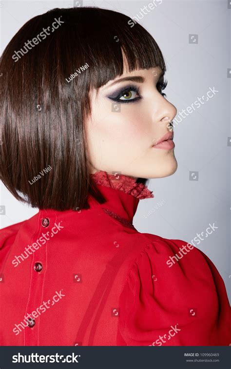 Beautiful Young Woman With Short Brown Hair In Red Vintage