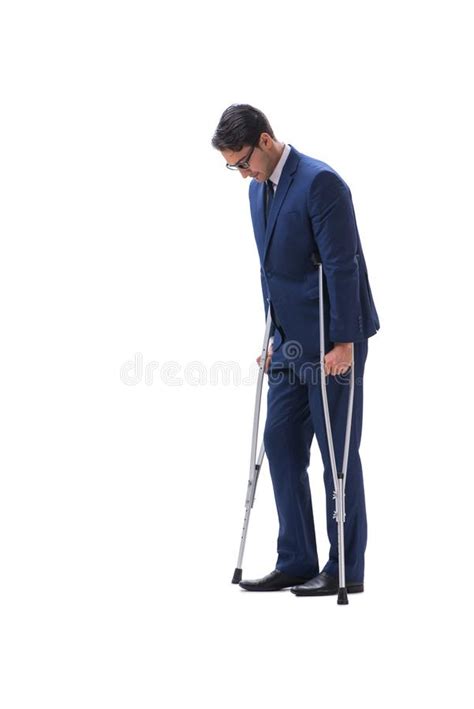 The Businessman Walking With Crutches Isolated On White Background