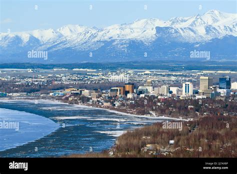 Anchorage City Aerial View In Alaska With Mountain Range Behid