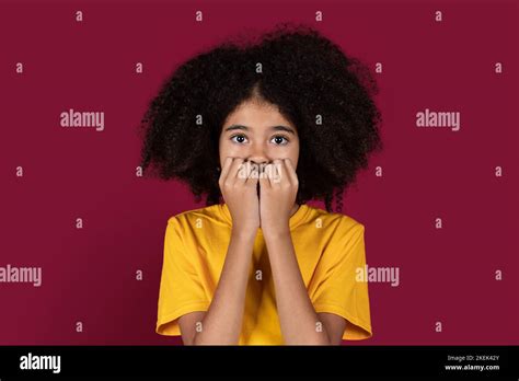 Scared African American Child Covering Her Mouth Stock Photo Alamy