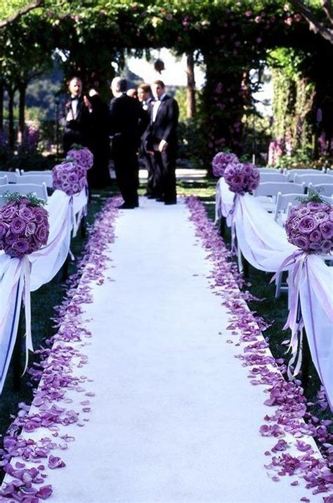 Pomanders Of Purple Roses Scattered Petals And Purple Satin Ribbons