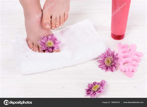 Cropped Image Barefoot Woman Towel Flowers Toe Finger Separators Cream