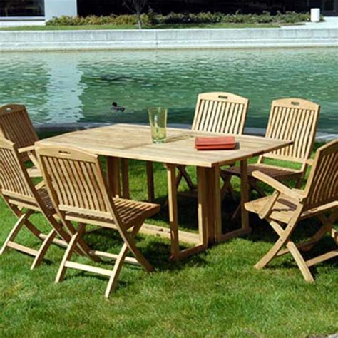 A classic rectangular dining table with 2 arm chairs and 4 side chairs. 6 feet Teak Oval Folding Outdoor Dining Table - Olympus ...