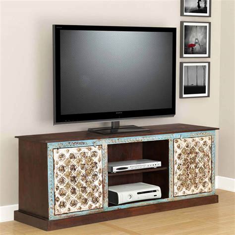 Designed in a library style, this unit has three separate compartments, each with fully adjustable shelves that make storing a variety of media easy. Cincinnati Intricate crafted 59" Wide Accent Media Console ...