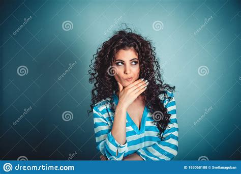 Thoughtful Woman Thinking Hand On Chin Looking To Side Stock Photo