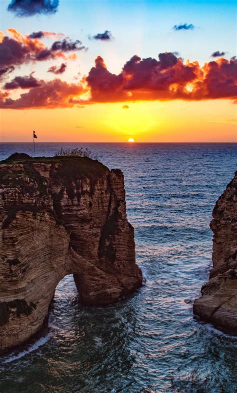 Download 1280x2120 Wallpaper Raouché Beirut Rocks Sea Sunset