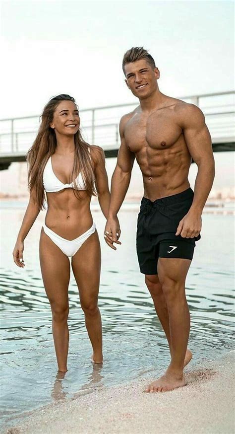 Couple Looking Great With Their Fitness And Appearance While In Their Swimsuits At The Beach