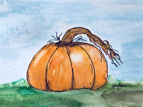 An Orange Pumpkin Sitting On Top Of A Green Grass Covered Field With