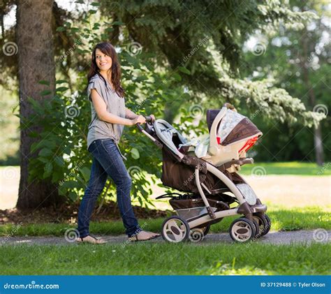 Beautiful Mother Pushing Baby Carriage In Park Stock Photo Image Of